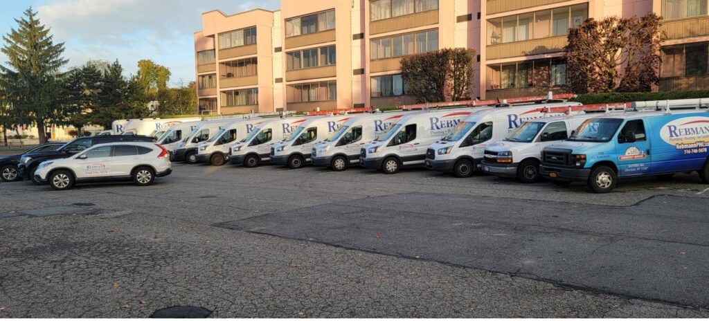 Row of Rebmann service trucks parked in a lot