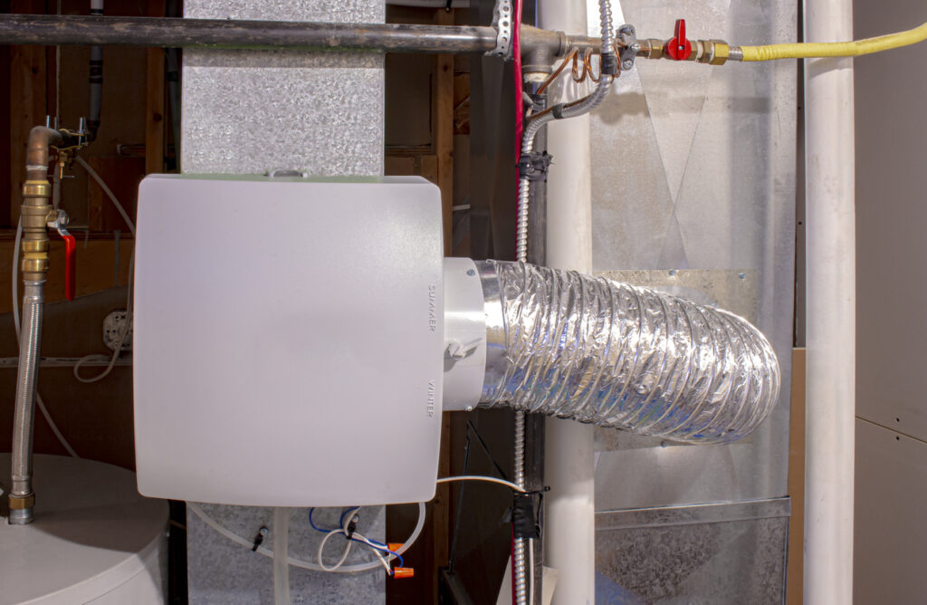 Whole-home humidifier attached to HVAC system